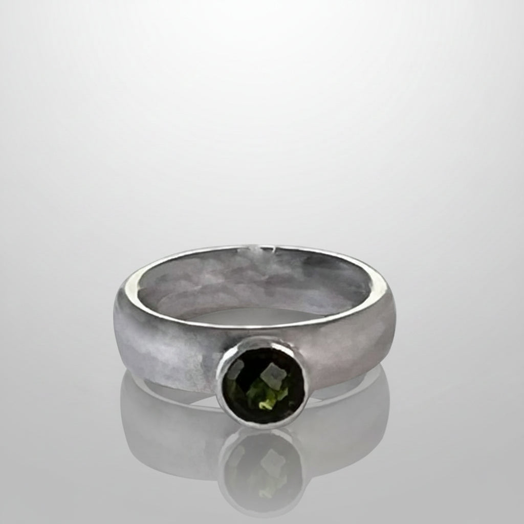Chunky silver ring with green tsavorite