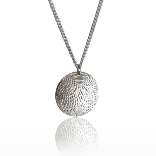 siler domed pendant with optical design on a white background hanging