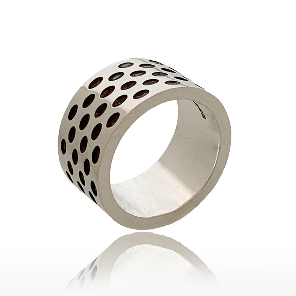 Solid silver ring with black dots design