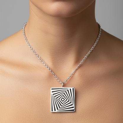 Necklace with a black and white geometric pendant on a neutral background