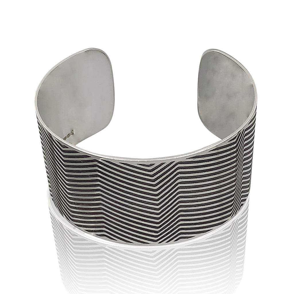 silver cuff with lines oxidised