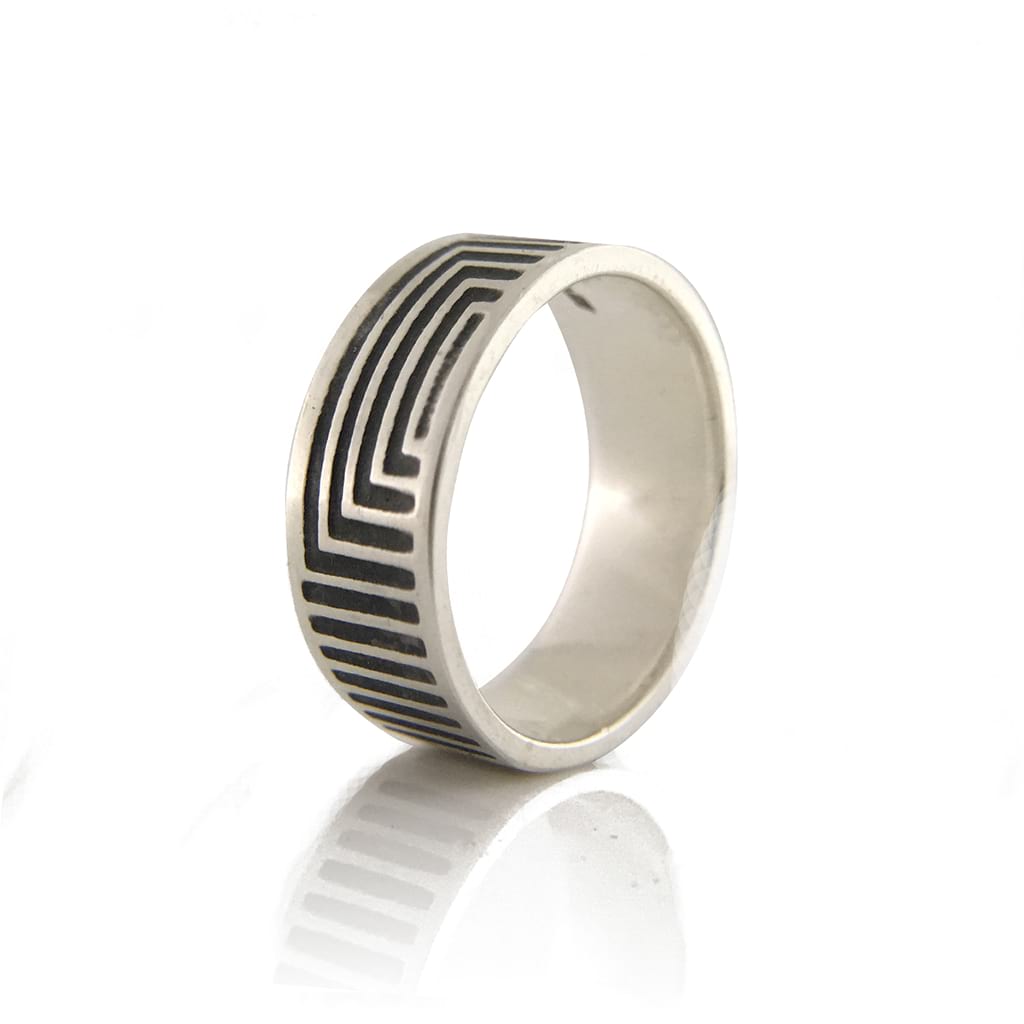 Silver Ring Band with Oxidised lines on a White Background