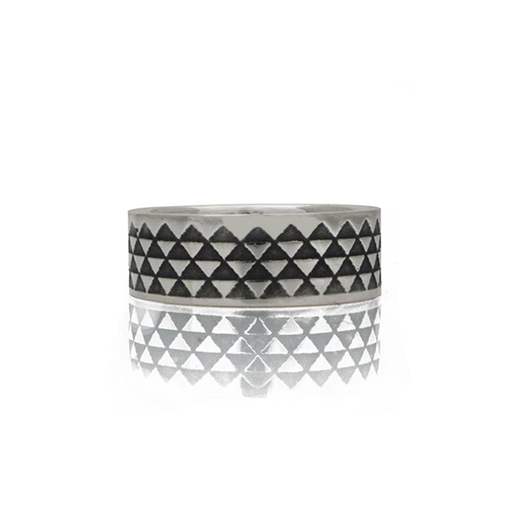 triangle ring with oxidised design detail on a white background