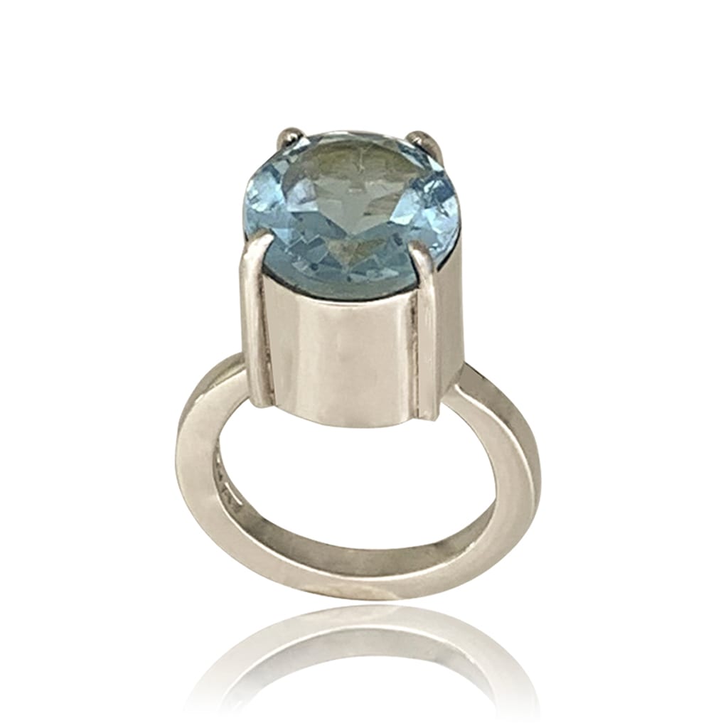 sliver ring with sky blue Topaz on a white background